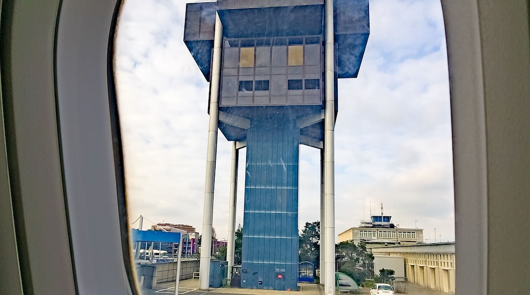 Vertical shot of the Geneva airport control tower through an airplane window