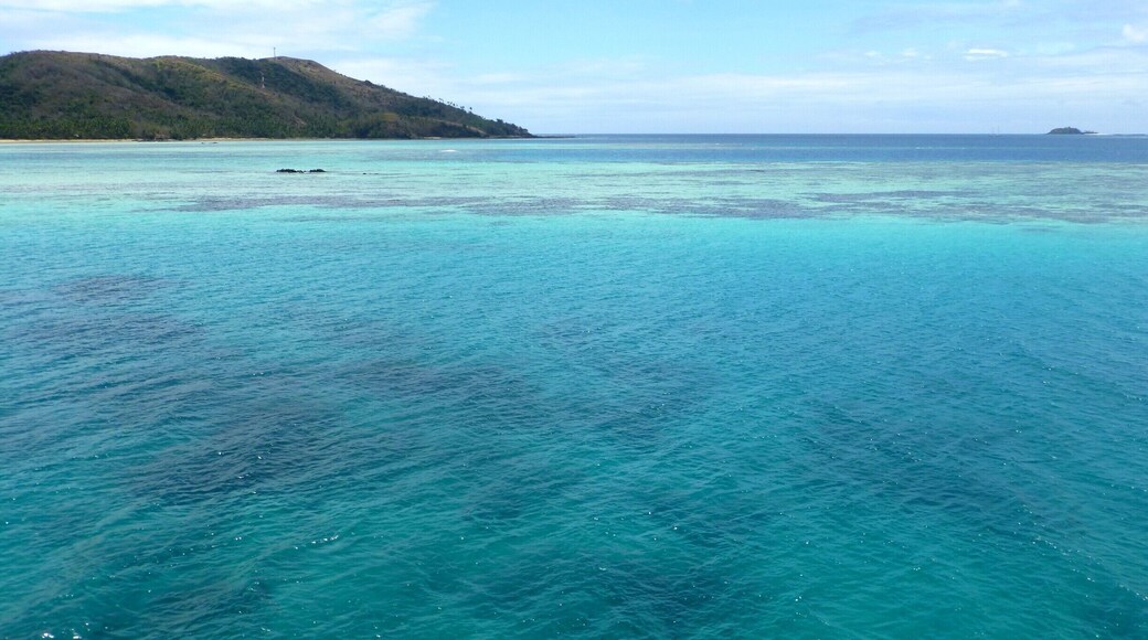 If you visit Fiji I would highly recommend taking the Yasawa Flyer to get a great view of the islands with this view as the creme de la creme where the flyer turns around and heads back past all the islands. A full day of sitting and relaxing on top of this boat. The colors of the water and the movement of the clouds is stunning.