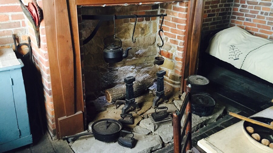 Inside the Prickett's family log home. Living quarters and kitchen all in one area which sheltered 16 children at one point in time.