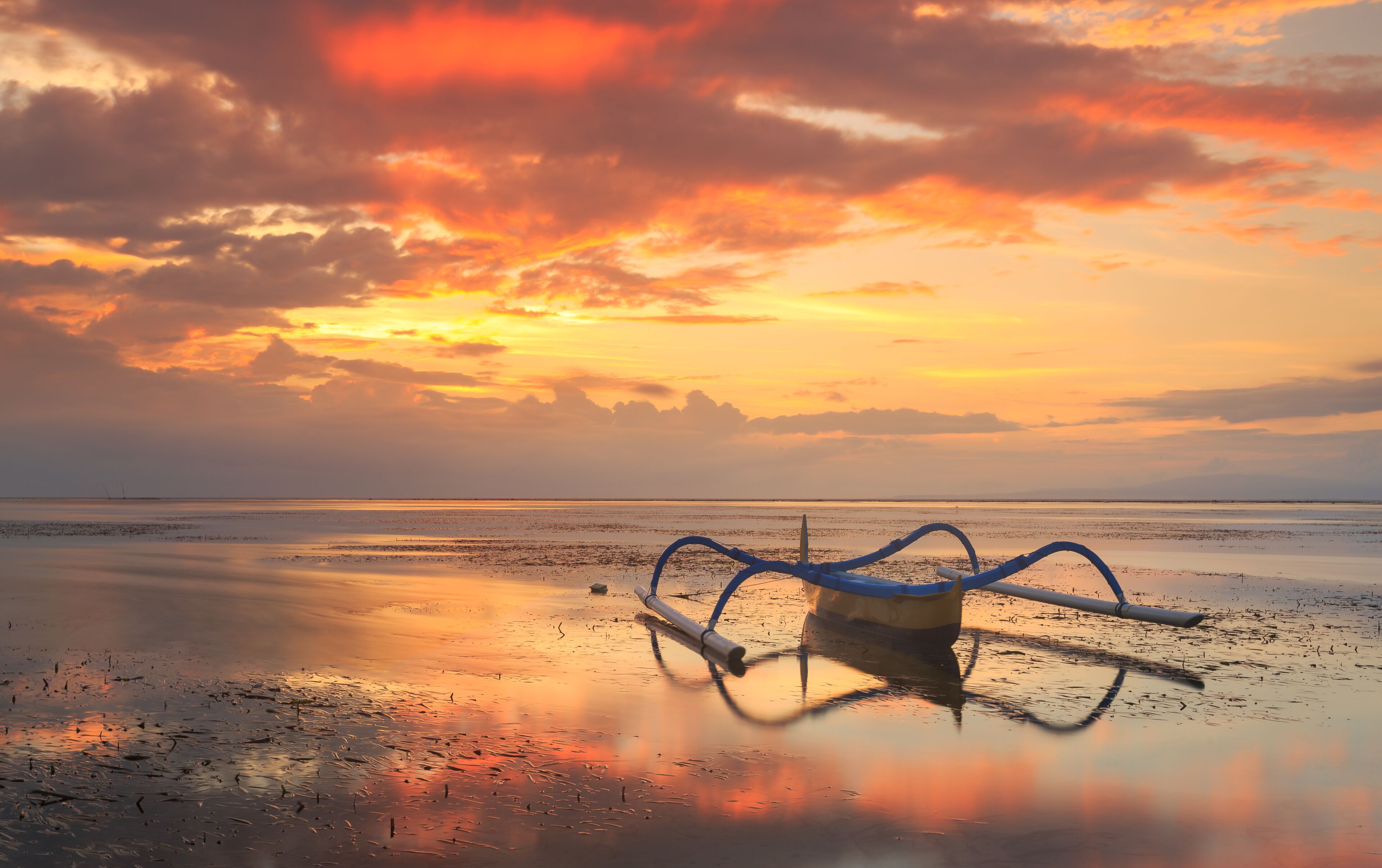 Jukung on beach at sunset, Sanur beach, Denpasar, Bali, Indonesia