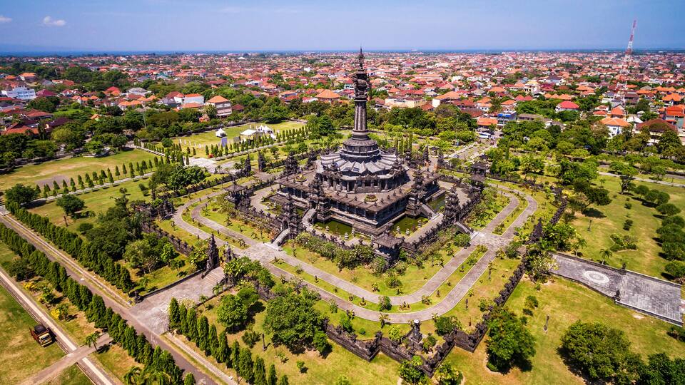 An aerial view of a historic temple complex surrounded by a cityscape.
