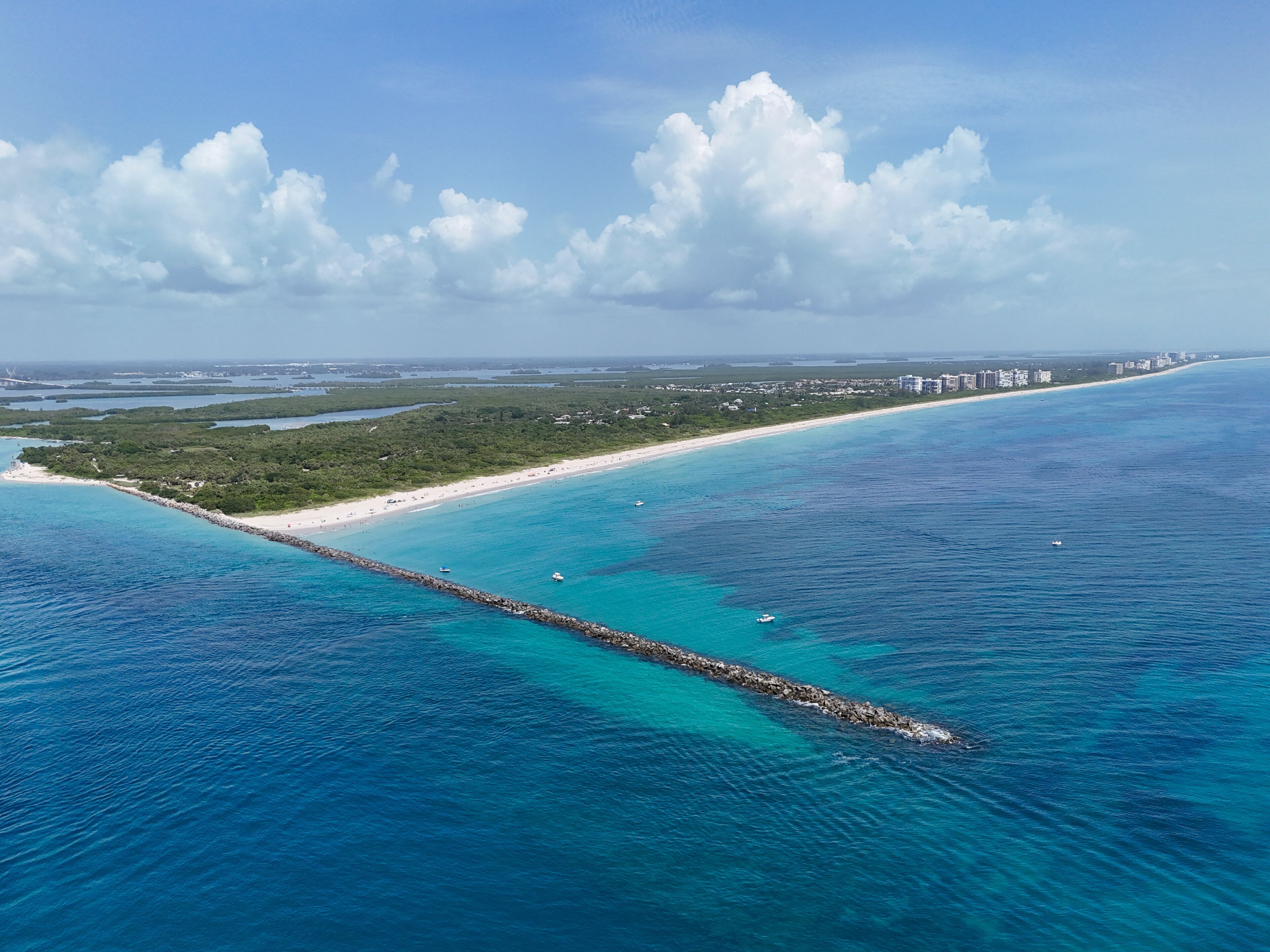 A long protective jetty at Fort Pierce Inlet State Park on the Treasure Coast of Florida in St. Lucie County