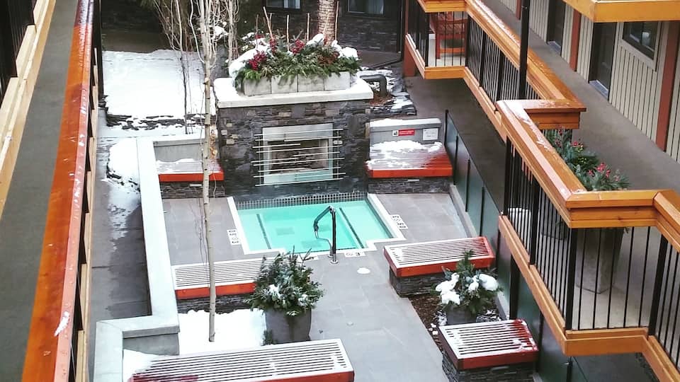 While in Banff I stayed at Banff Aspen Lodge. While the hotel was incredible the noise not so much. It's a super affordable hotel which tends to attract younger partiers.
While I didn't get much sleep I did enjoy the fireside outdoor hot tubs.
Towels are provided by the hotel and there is a local coffee shop right in the lobby.
The hotel serves a full breakfast, has free WiFi and parking.