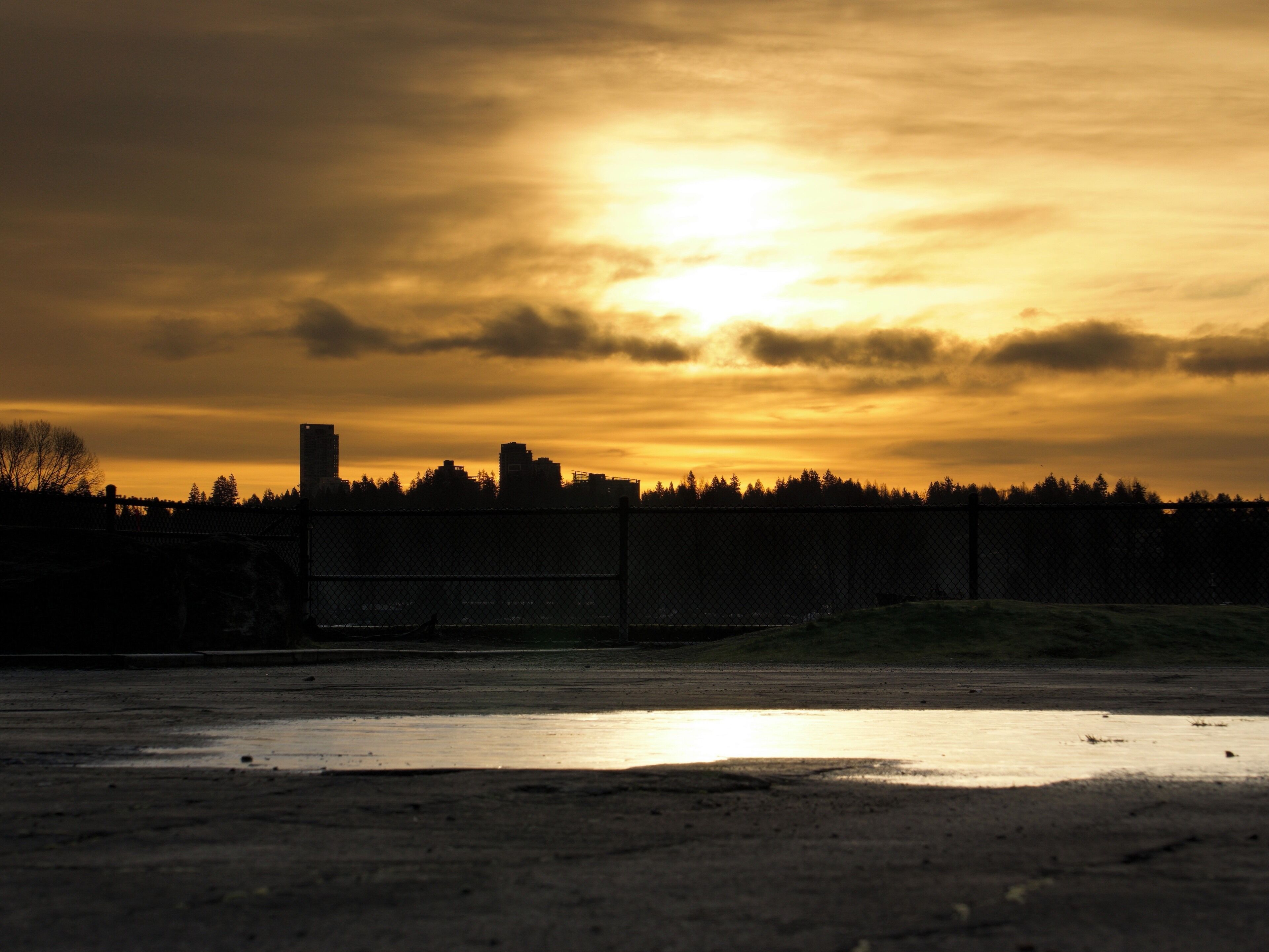 Photo shot taken next to an art installation ‘W’ in New Westminster, BC. 

If you visit ‘W’ right after rain stops, there are many water puddles that reflect sun lights beautifully - you will like it as much as I do.