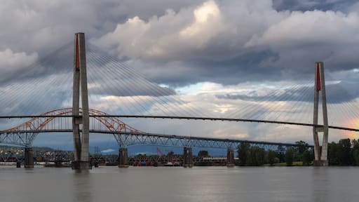 Panoramic view of Skytrain Bridge and Pattullo Bridge during a stormy evening. Taken in New Westminster, Greater Vancouver, BC, Canada.