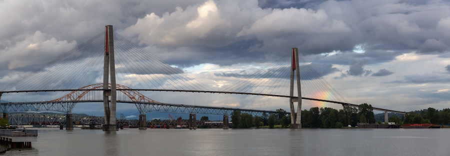 Panoramic view of Skytrain Bridge and Pattullo Bridge during a stormy evening. Taken in New Westminster, Greater Vancouver, BC, Canada.