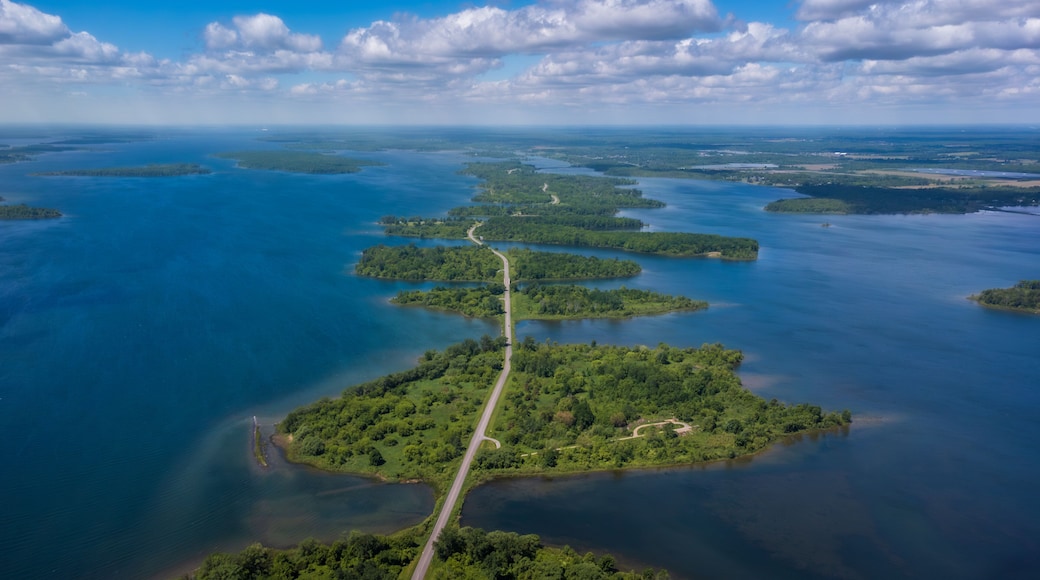 Aerial photo of Long Sault Parkway scenic route crossing Thousand Islands archipelago in the Saint Lawrence River near Cornwall, South Stormont, Ontario, Canada. Photo taken by drone in June 2022.