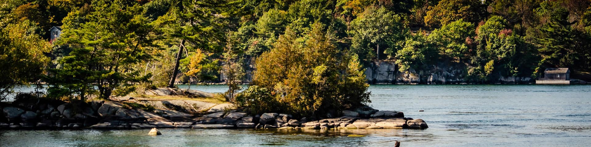Small Island in the Thousand Islands, St. Lawrence River with a treed background