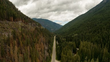 Aerial Panoramic View of a Scenic Highway in the Valley surrounded by Canadian Mountain Landscape. Taken near Creston, British Columbia, Canada.