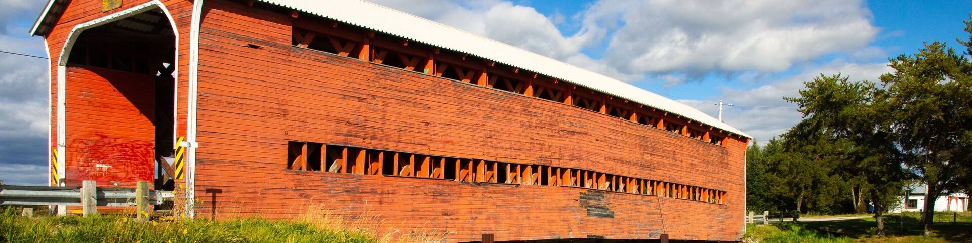 Vertical shot of orange covered Champagne Bridge, near Val-d'Or, Abitibi-Temiscamingue, Quebec