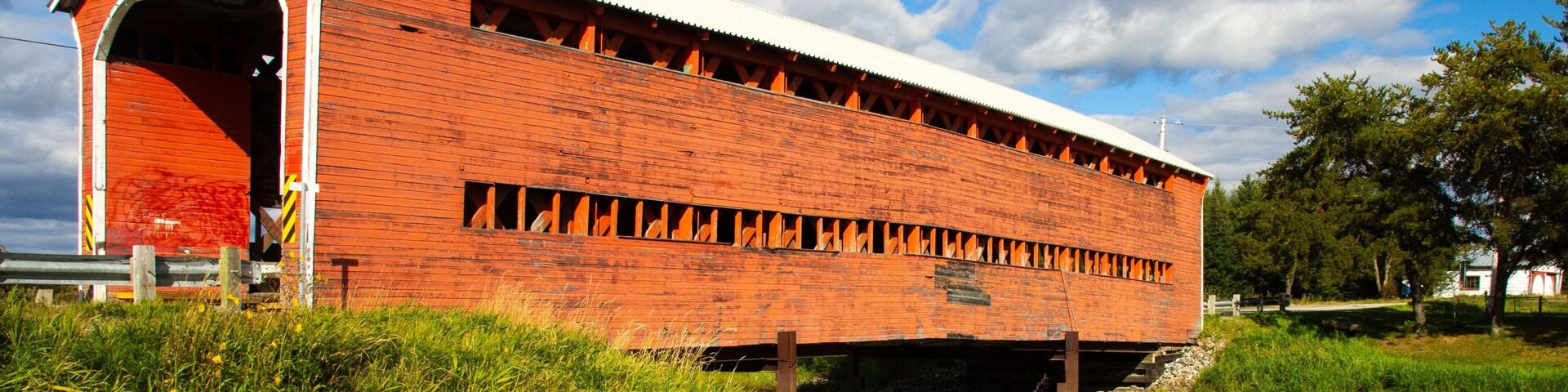 Vertical shot of orange covered Champagne Bridge, near Val-d'Or, Abitibi-Temiscamingue, Quebec