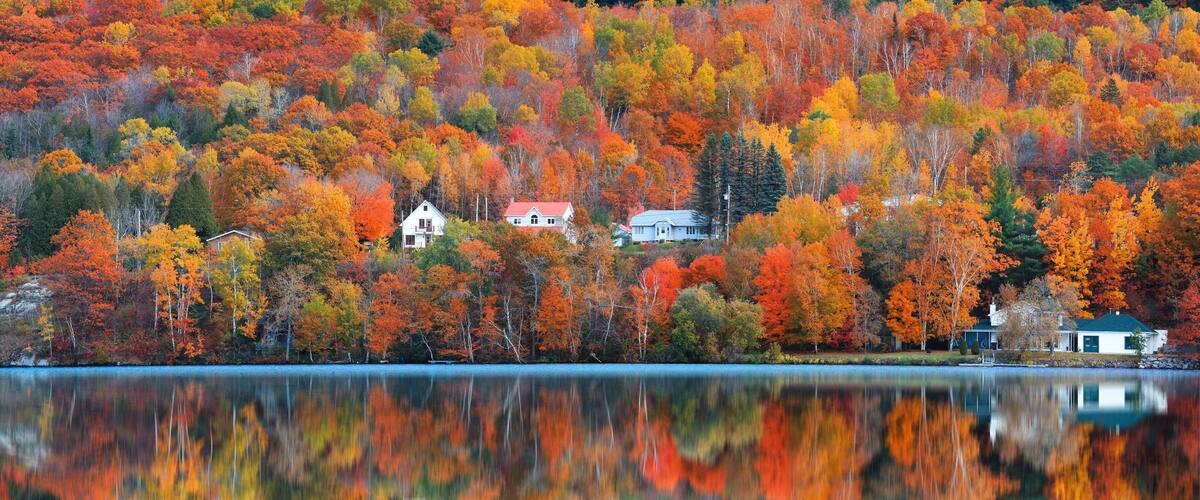 Panoramic view of Saint-Jean-des-Piles village surrounded with bright fall foliage in Quebec, Canada