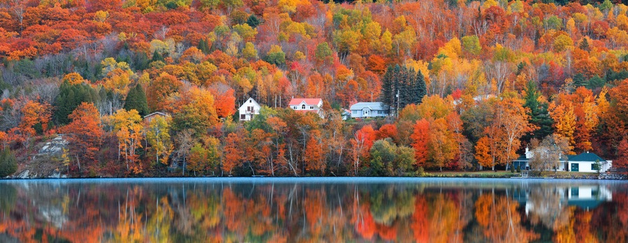 Panoramic view of Saint-Jean-des-Piles village surrounded with bright fall foliage in Quebec, Canada