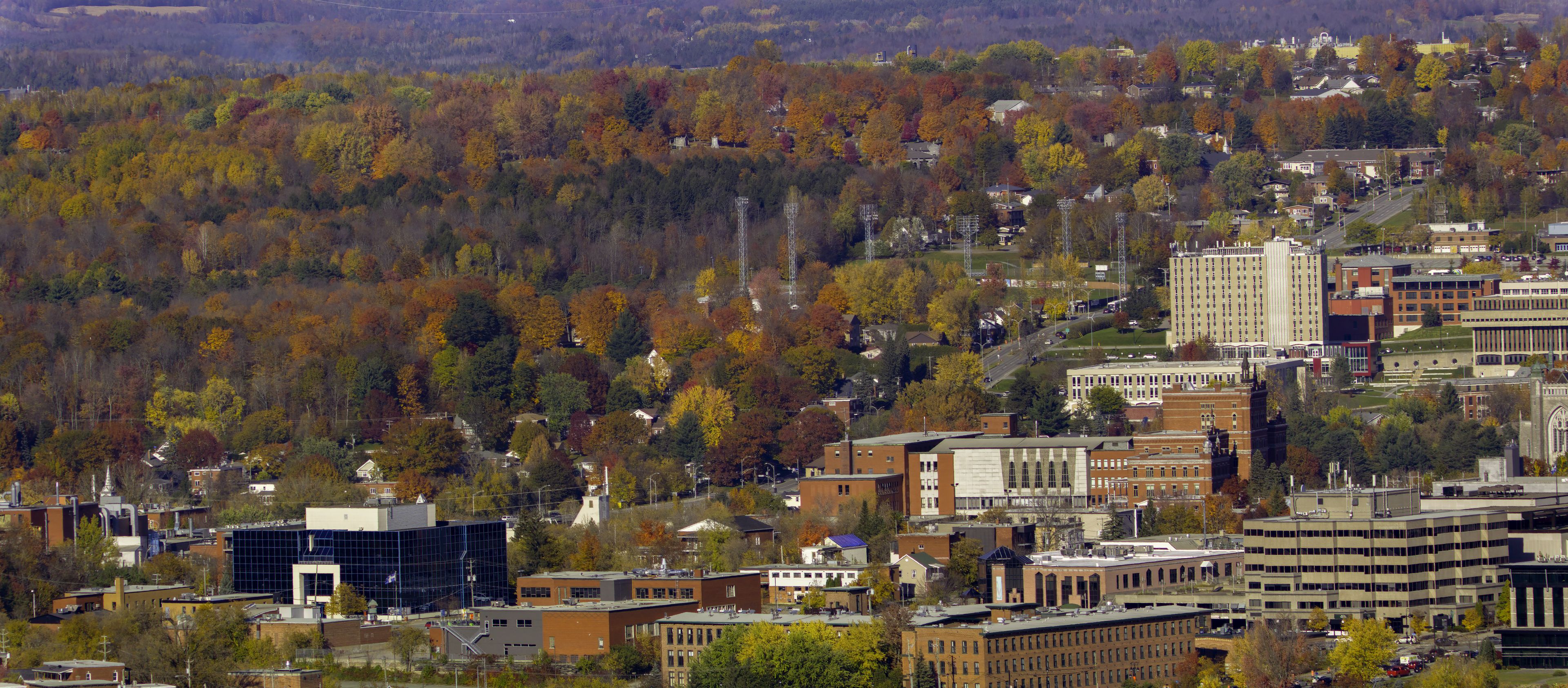 small city in the forest Sherbrooke downtown Eastern Townships clouds and traffic autumn colors