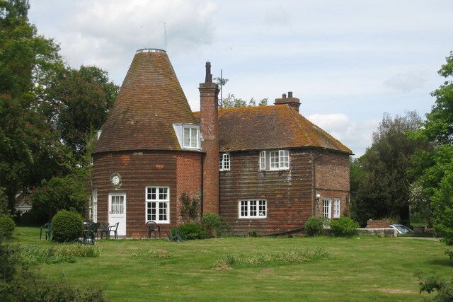 Oast House at Pekes, Nash Street, Golden Cross, East Sussex Twin round kiln oast house, one kiln now has an eight sided roof, the other missing its cowl. Keywords: roundel, converted, flat roof dormer, tile hanging, chimney, cowl-less