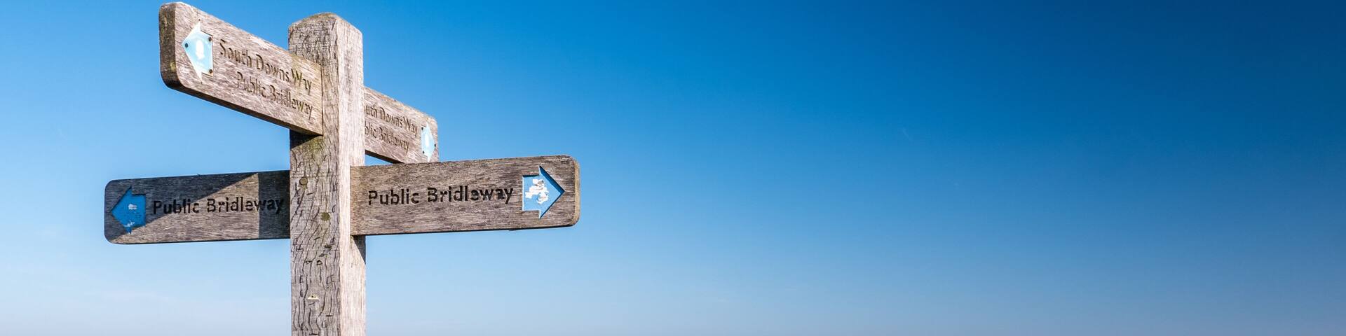The South Downs Way, England. A sign giving directions to the popular 100 mile hiking route between Winchester and Eastbourne on the south coast.