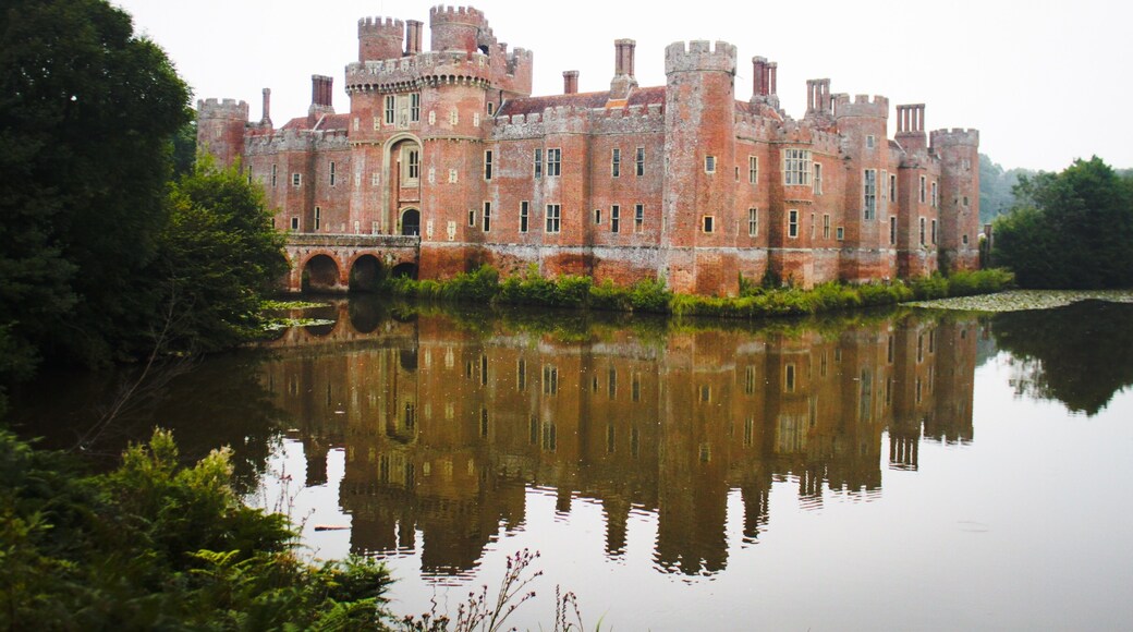 HERSTMONCEUX CASTLE WITH ATTACHED BRIDGES TO NORTH AND SOUTH AND CAUSEWAY WITH MOAT RETAINING WALLS TO WEST Wikidata has entry Q2652207 with data related to this building.