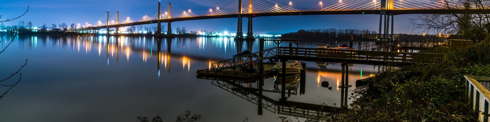 The Golden Ears Bridge, conecting Maple Ridge to Langley. Long exposure at night, reflecting into Fraser River.