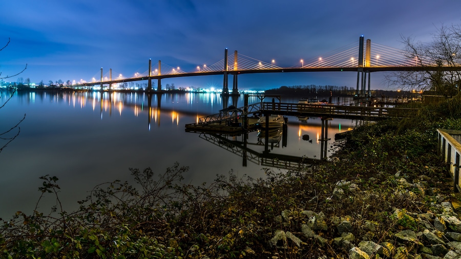 The Golden Ears Bridge, conecting Maple Ridge to Langley. Long exposure at night, reflecting into Fraser River.
