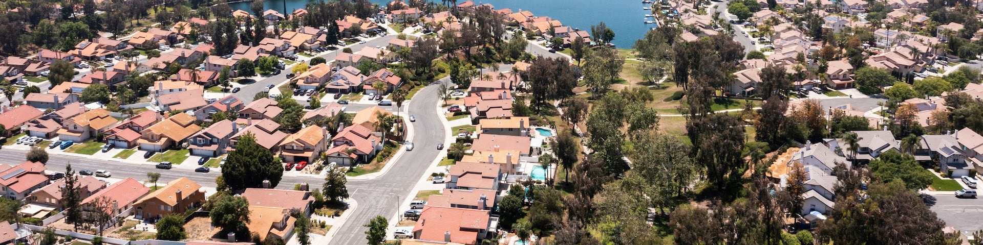 Daytime aerial view of a suburban neighborhood in Moreno Valley, California, USA.