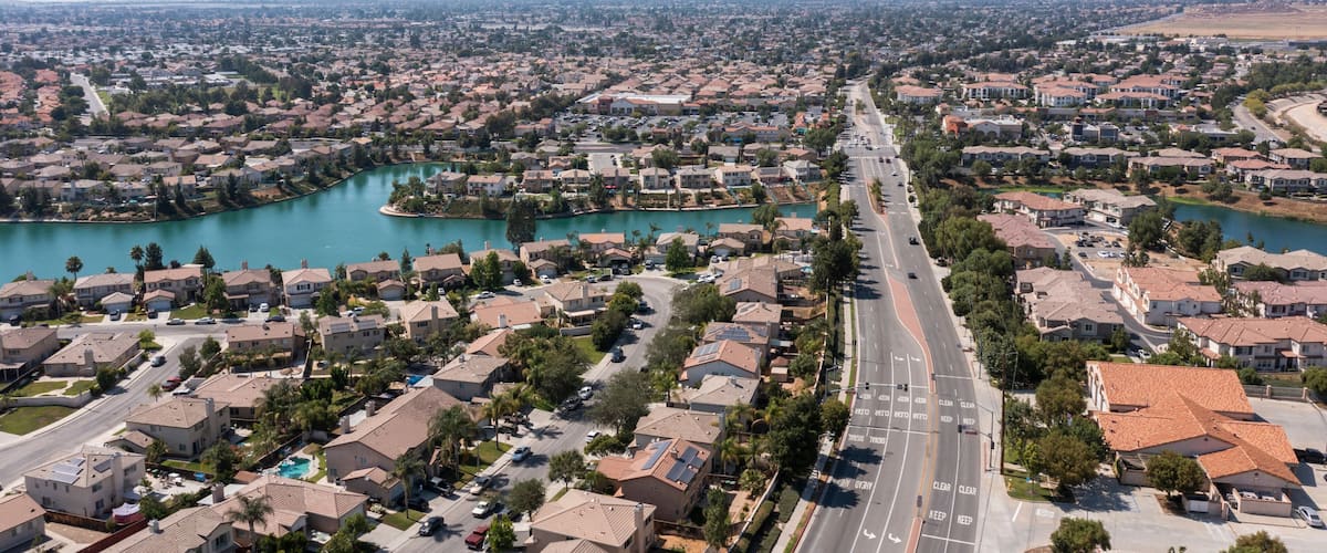 Daytime aerial view of a suburban neighborhood in Moreno Valley, California, USA.