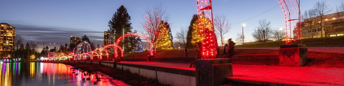 Trail in a park around Lafarge Lake with Christmas Lights. Located in Coquitlam, Greater Vancouver, British Columbia, Canada.