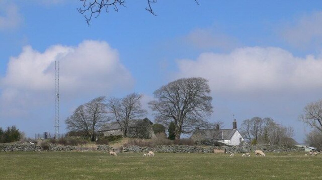 Old and new A modern communications mast alongside an old farm; Plas Iolyn was the home in Tudor times of the Prys family.
