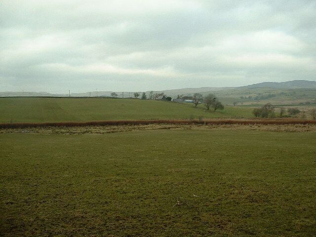 Farmland at Penrhyn Farm. Penrhyn Farm is in the centre, looking west towards the wonderful wild country of the Mynydd Hiraethog.