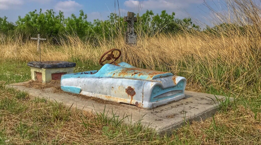 Cool to see a "toy" car atop the slab at a gravesite