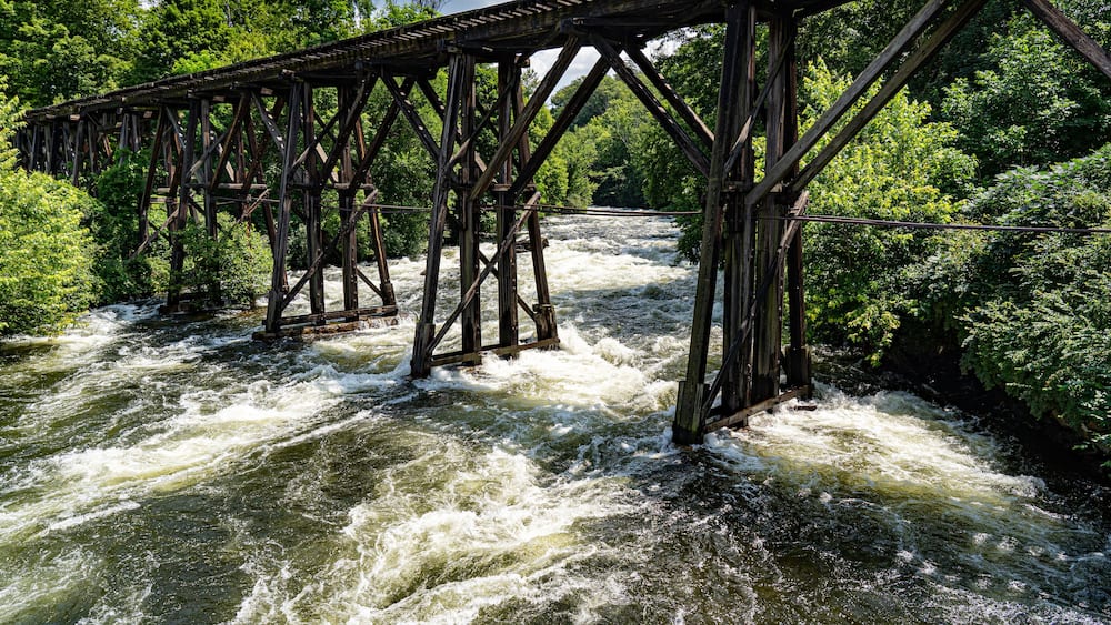 The wooden railroad bridge over the Winnipesaukee River in Franklin, New Hampshire