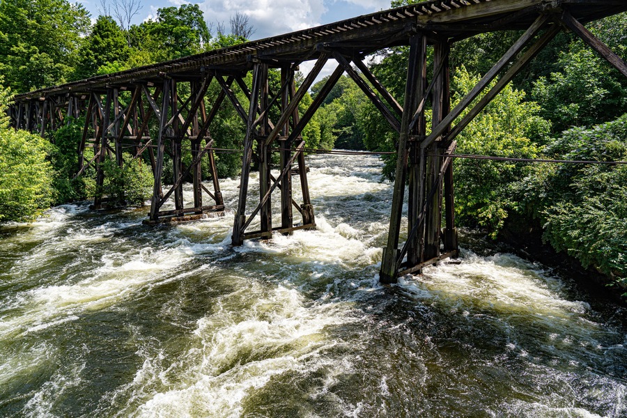 The wooden railroad bridge over the Winnipesaukee River in Franklin, New Hampshire