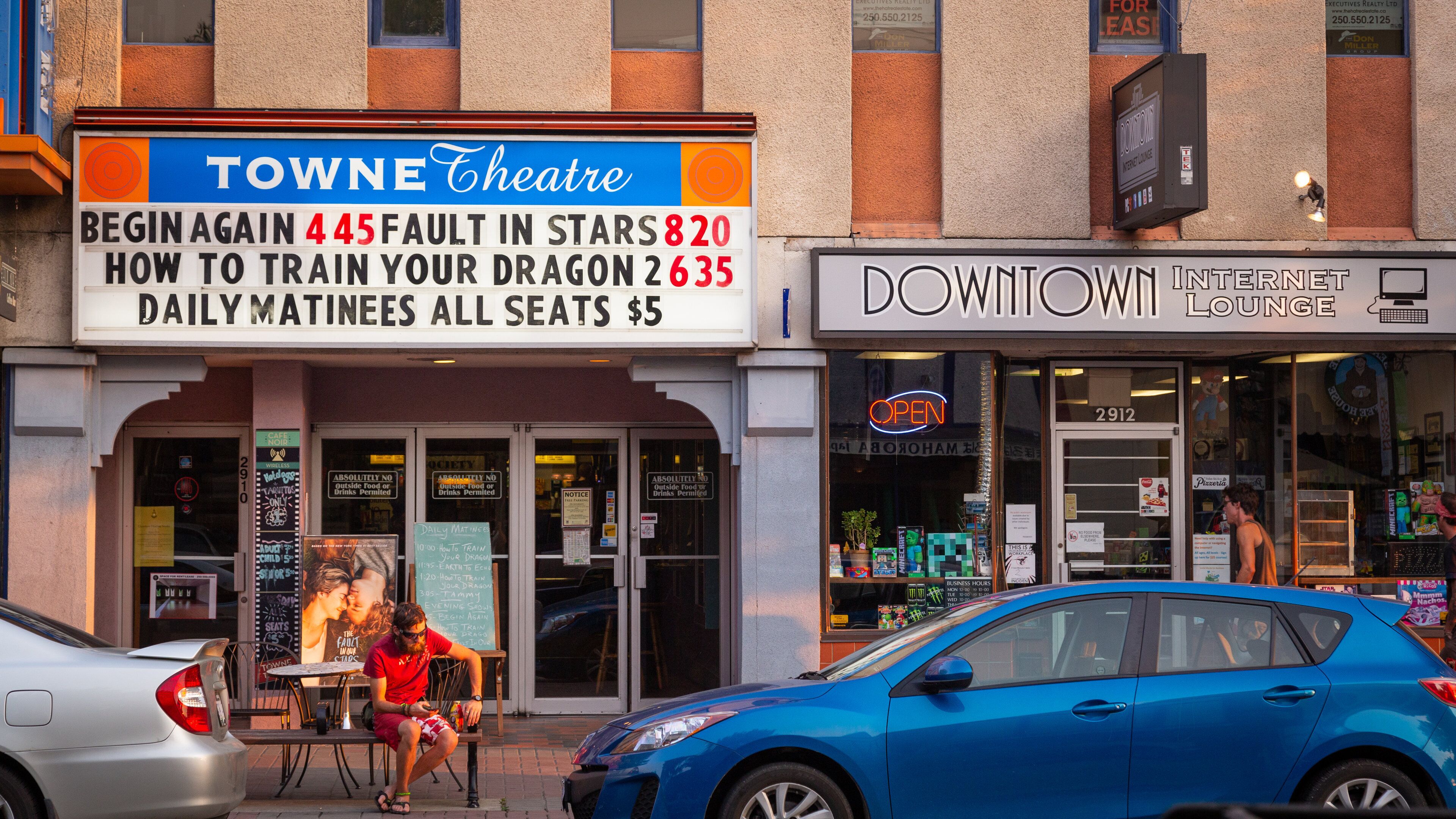 Towne Theatre with a sign advertising matinee shows.