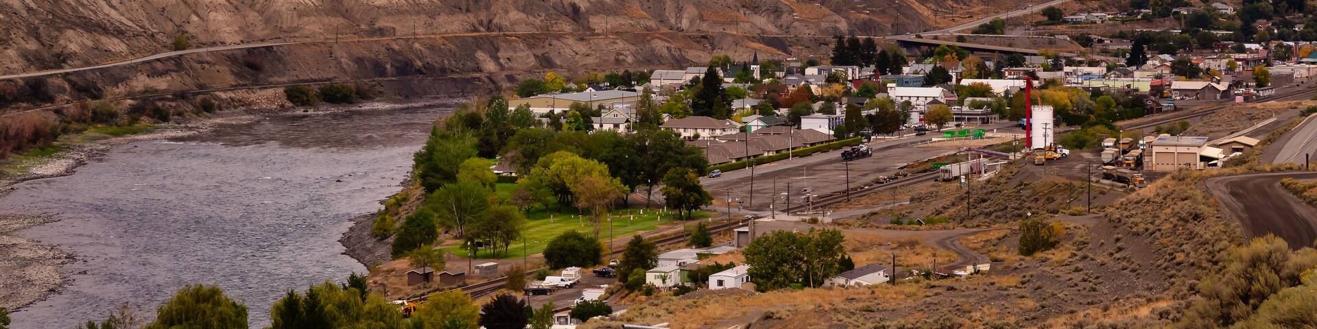 View of a small town, Ashcroft, by the Thompson River in the interior of British Columbia, Canada. Sunset Sky