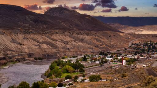 View of a small town, Ashcroft, by the Thompson River in the interior of British Columbia, Canada. Sunset Sky