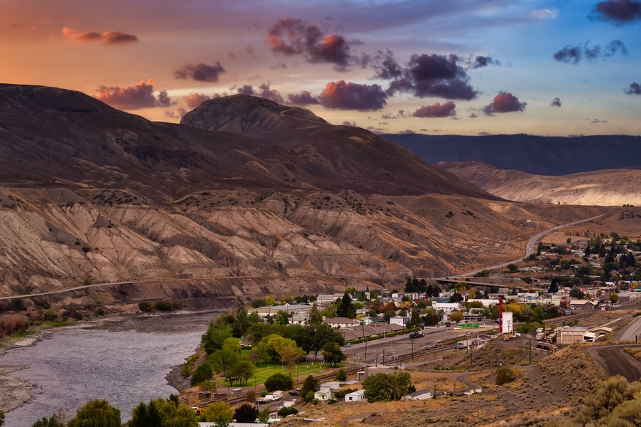 View of a small town, Ashcroft, by the Thompson River in the interior of British Columbia, Canada. Sunset Sky