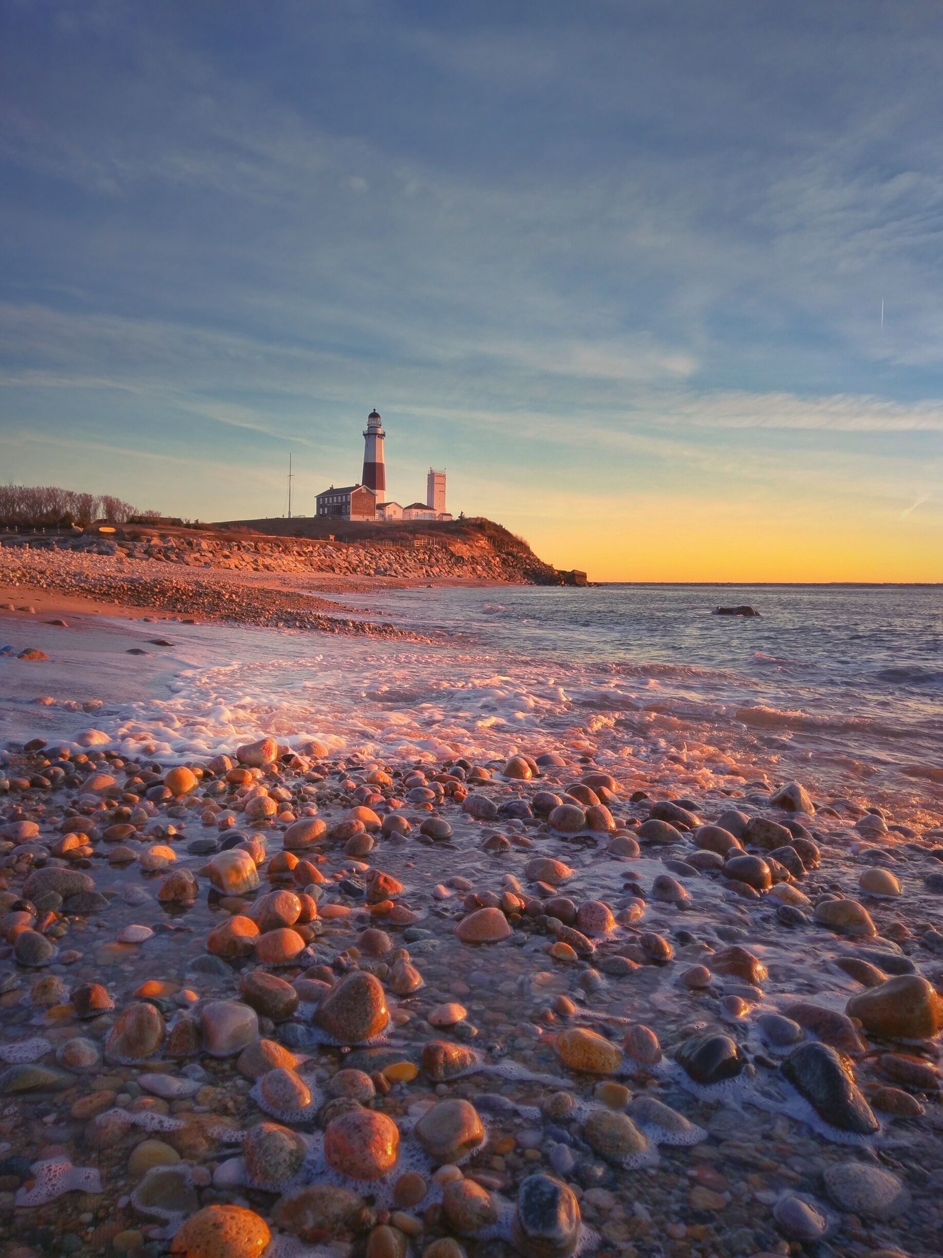 Sunrise at montauk lighthouse. The light house is north from this side 