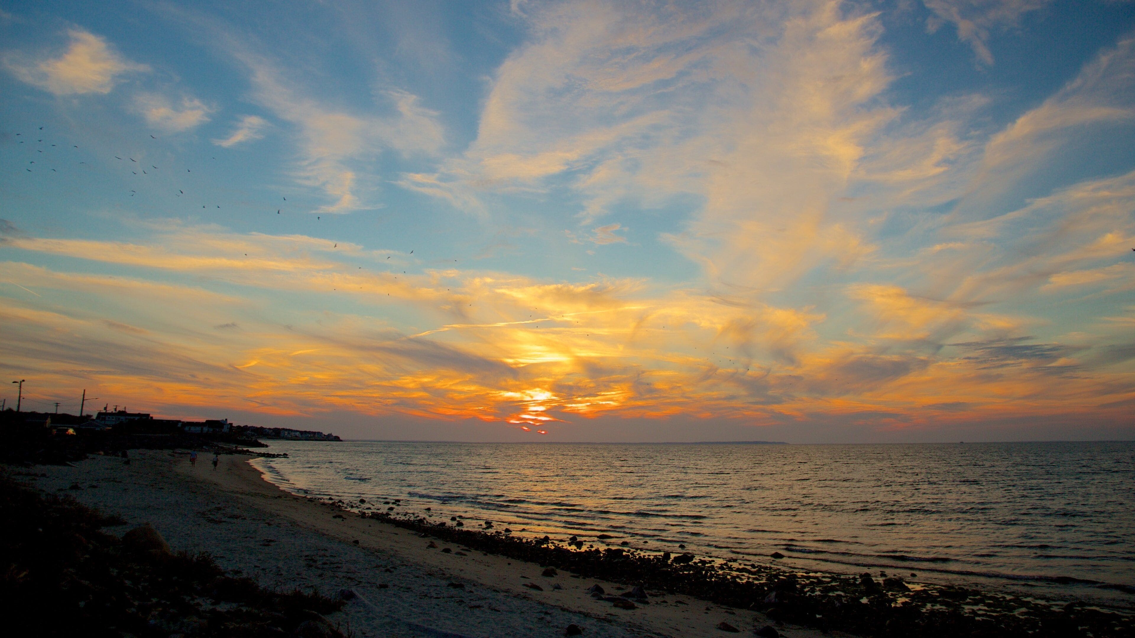 Montauk showing a sunset and a pebble beach