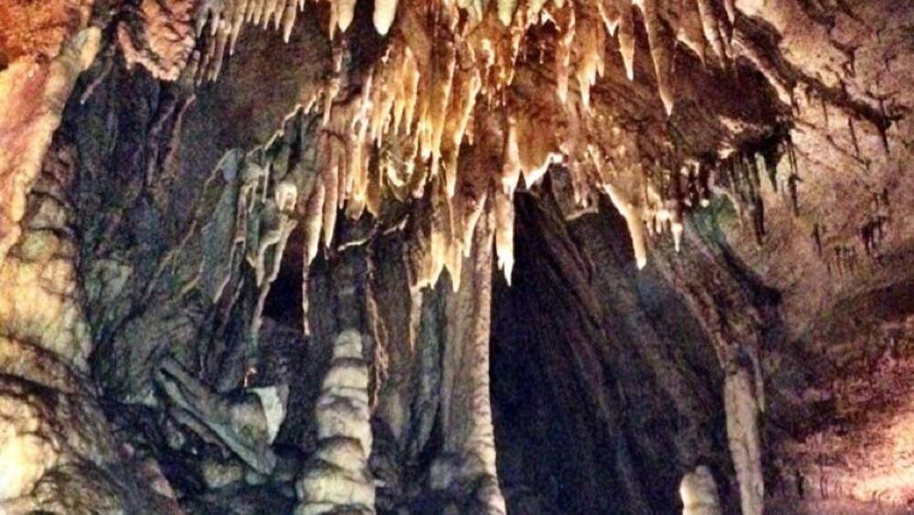 A cave with stalactites and stalagmites.