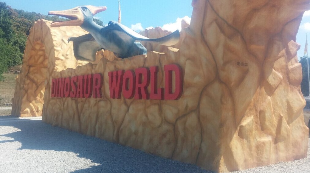 Dinosaur World, if it must be labeled a tourist trap, it's most definitely a high end tourist trap with over 150 life size fiberglass dinosaur sculptures spread along a wooded path over 20 acres.