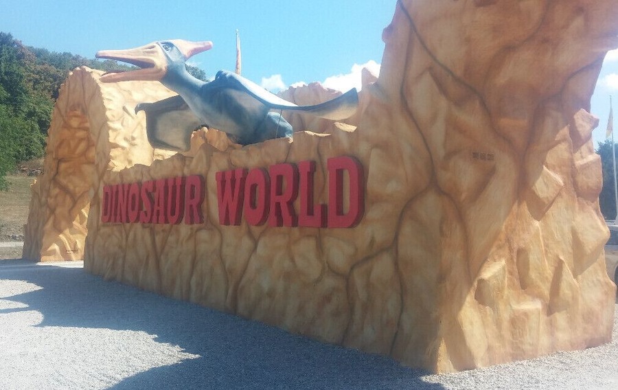 Dinosaur World, if it must be labeled a tourist trap, it's most definitely a high end tourist trap with over 150 life size fiberglass dinosaur sculptures spread along a wooded path over 20 acres.
