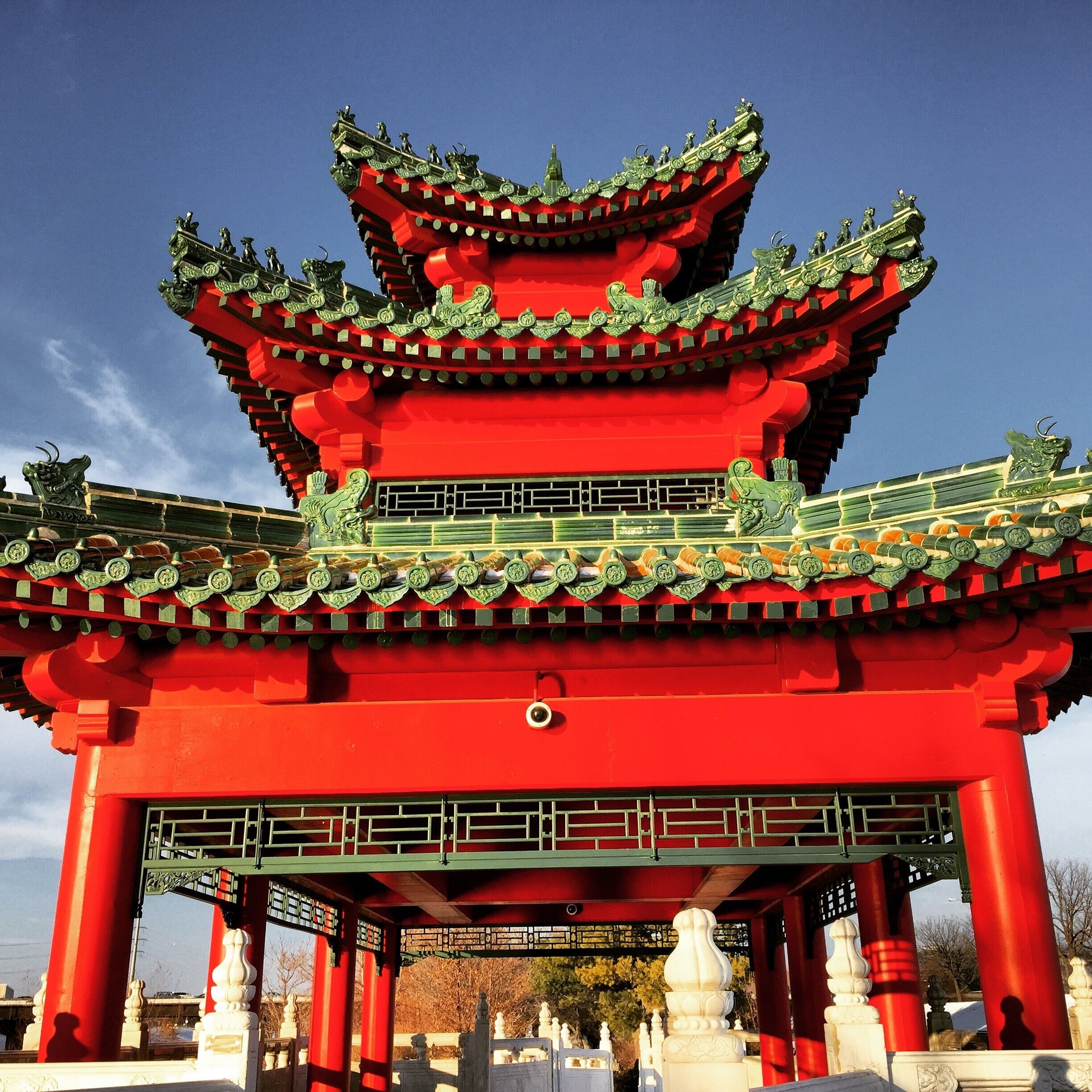 An interesting structure. Very ornamental roof. There is a pretty garden behind it, and a zodiac circle in front. 