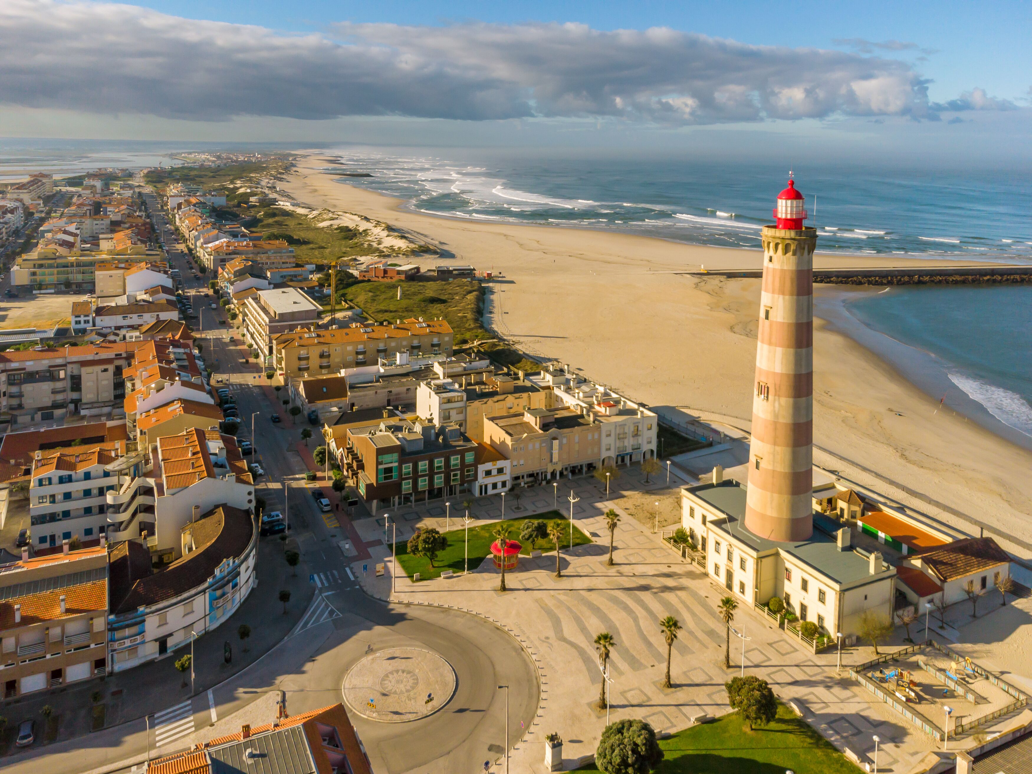 Lighthouse into the Barra beach in Aveiro, Portugal