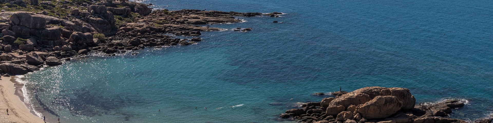Horseshoe Bay is Bowen's most iconic beach and a favourite for locals and visitors alike. The beach is framed by two granite outcrops which provide a haven for a wonderful range of fish and coral just a short swim from the beach. There is also a little resort next to the car park. This is taken from Rotary Outlook which is about 10 min walk from the carpark.