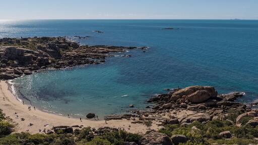 Horseshoe Bay is Bowen's most iconic beach and a favourite for locals and visitors alike. The beach is framed by two granite outcrops which provide a haven for a wonderful range of fish and coral just a short swim from the beach. There is also a little resort next to the car park. This is taken from Rotary Outlook which is about 10 min walk from the carpark.