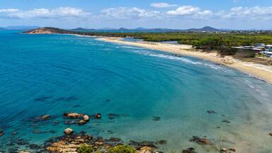aerial view of Rose Bay in Bowen, Queensland, showcasing turquoise waters and rocky headland