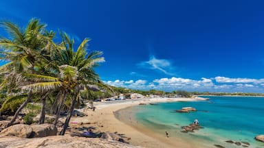 BOWEN, AUS - SEP 18 2017: Horseshoe Bay at Bowen - iconic beach with rocks and palm trees, Queensland, Australia