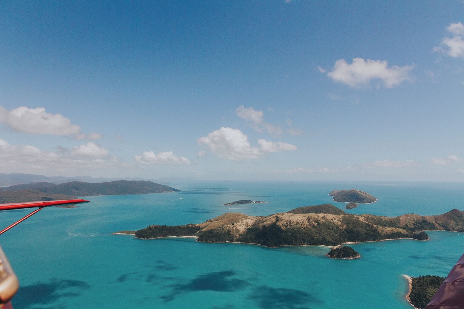 We recommend the Tiger Moth tour of the Whitsundays. Unique perspective 😍