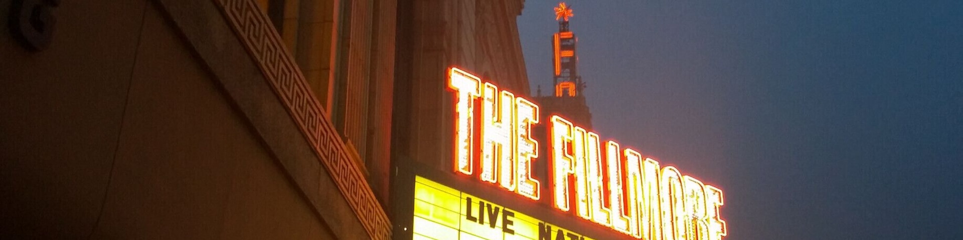 Opened in 1925  and known for most of its existence as the State Theatre, the recently rebranded Fillmore Detroit is a nearly 3000 seat concert venue.
The towering marquee of the neighboring Fox Theatre can be seen photo-bombing in the backdrop.
