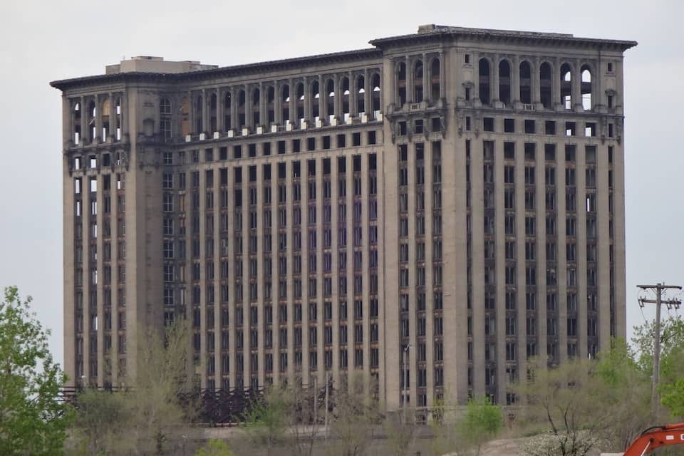 A large, multi-story building with extensive window openings and a central courtyard.