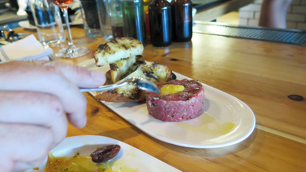 We almost skipped this Midtown restaurant after being turned away the night before but I am glad we went back and gave it a second try. This immensely popular eatery seems to always be packed so unless you make a reservation, go soon after they open to at least snag a seat at the bar. We shared the steak tartare and charred octopus with a glass of rose. Our waiter was great, the place is lovely with a laid back atmosphere